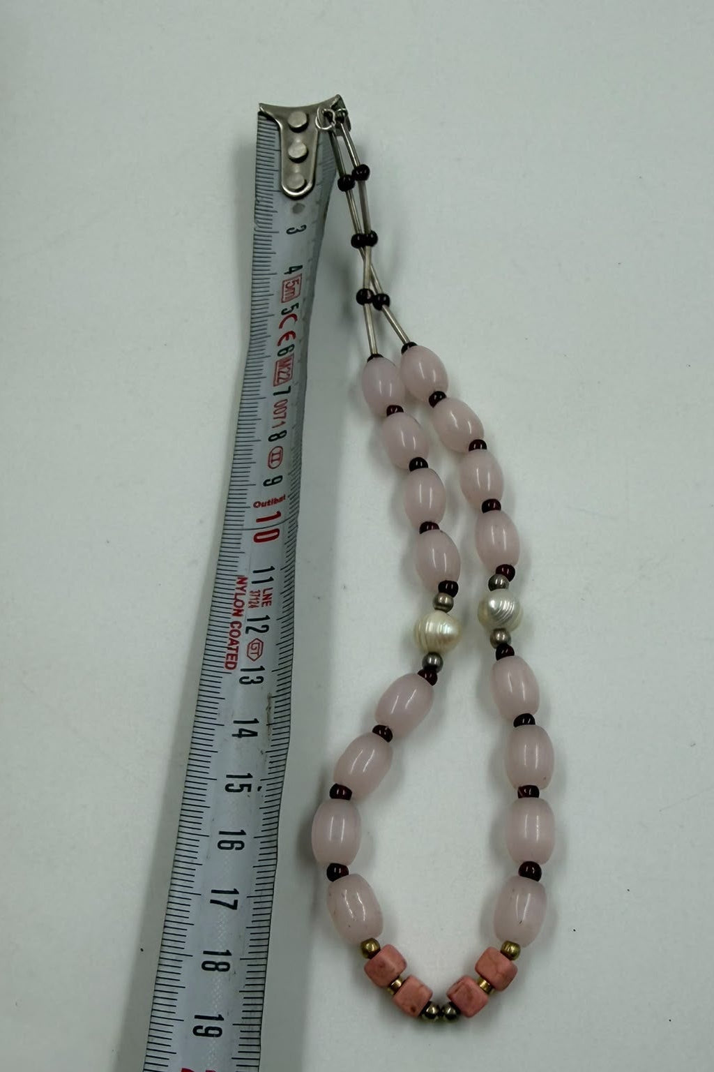 Natural rose quartz garnet pink coral pearl bracelet on bust display showing full 20cm length with 925 silver clasp