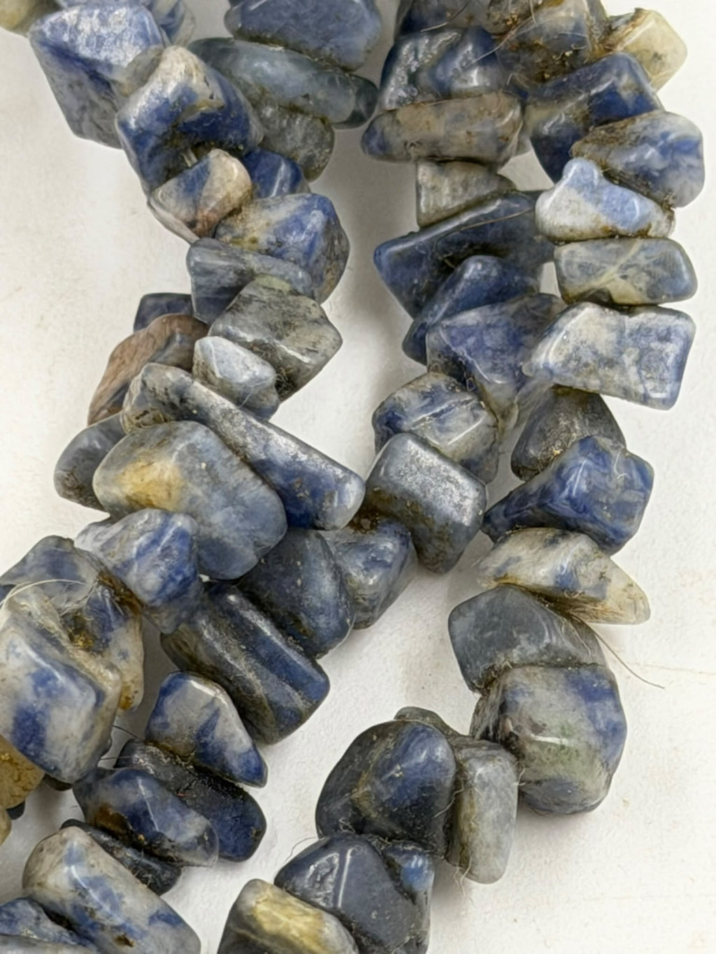 Natural sodalite chip necklace weight 58 grams on digital scale