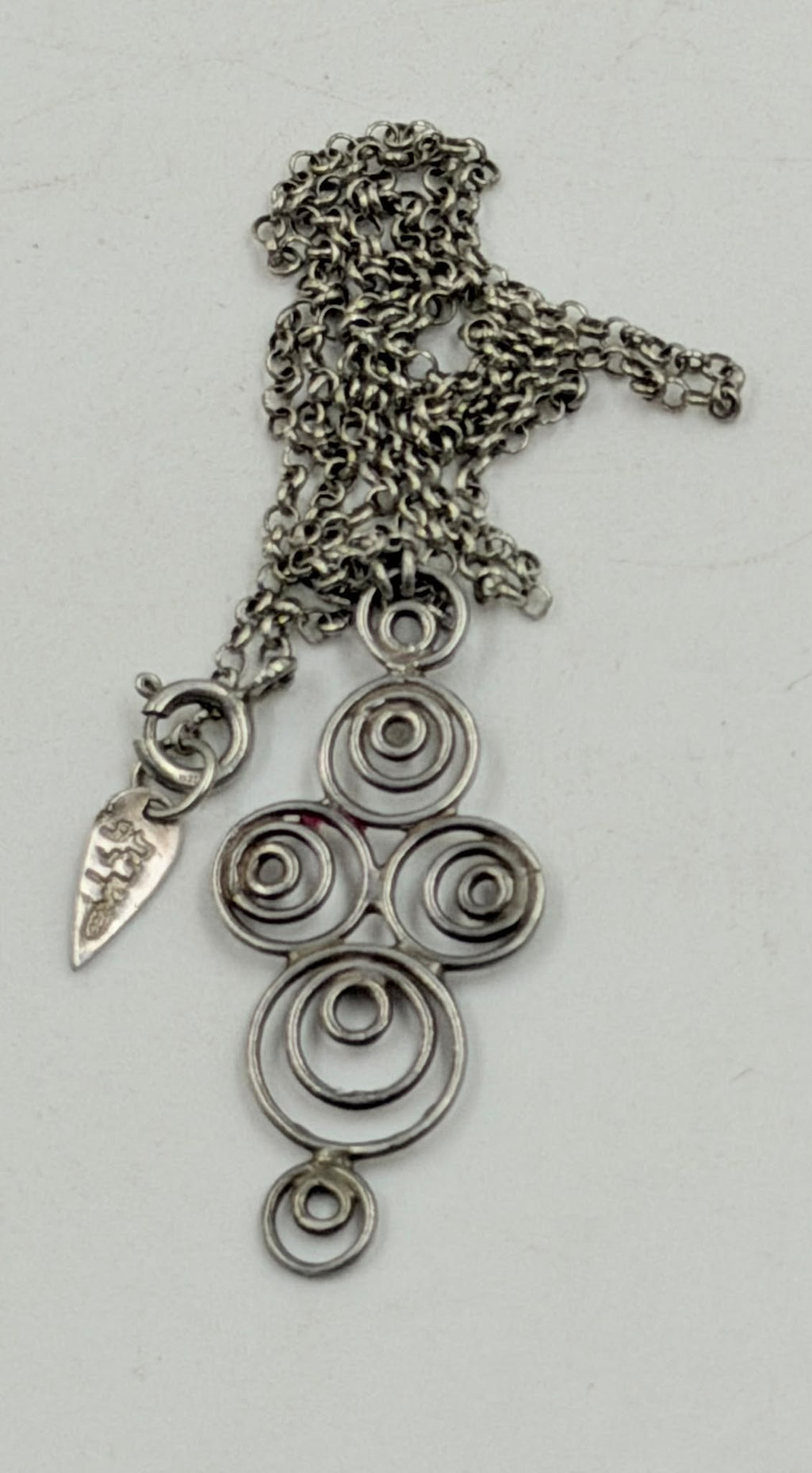 925 stamped spring ring clasp close-up with small leaf hallmark tag