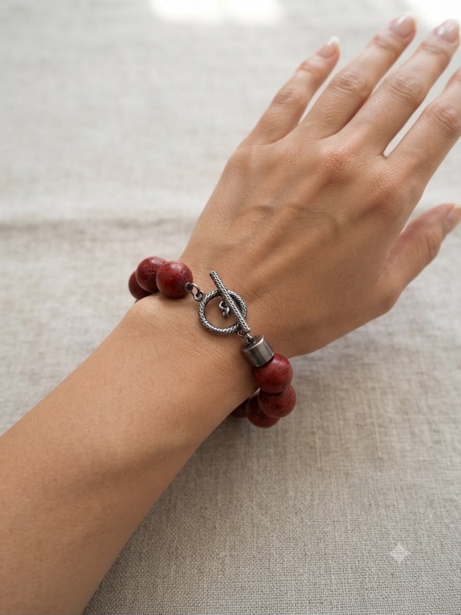 Natural red coral bracelet full flat lay on white background showing complete bracelet design and clasp