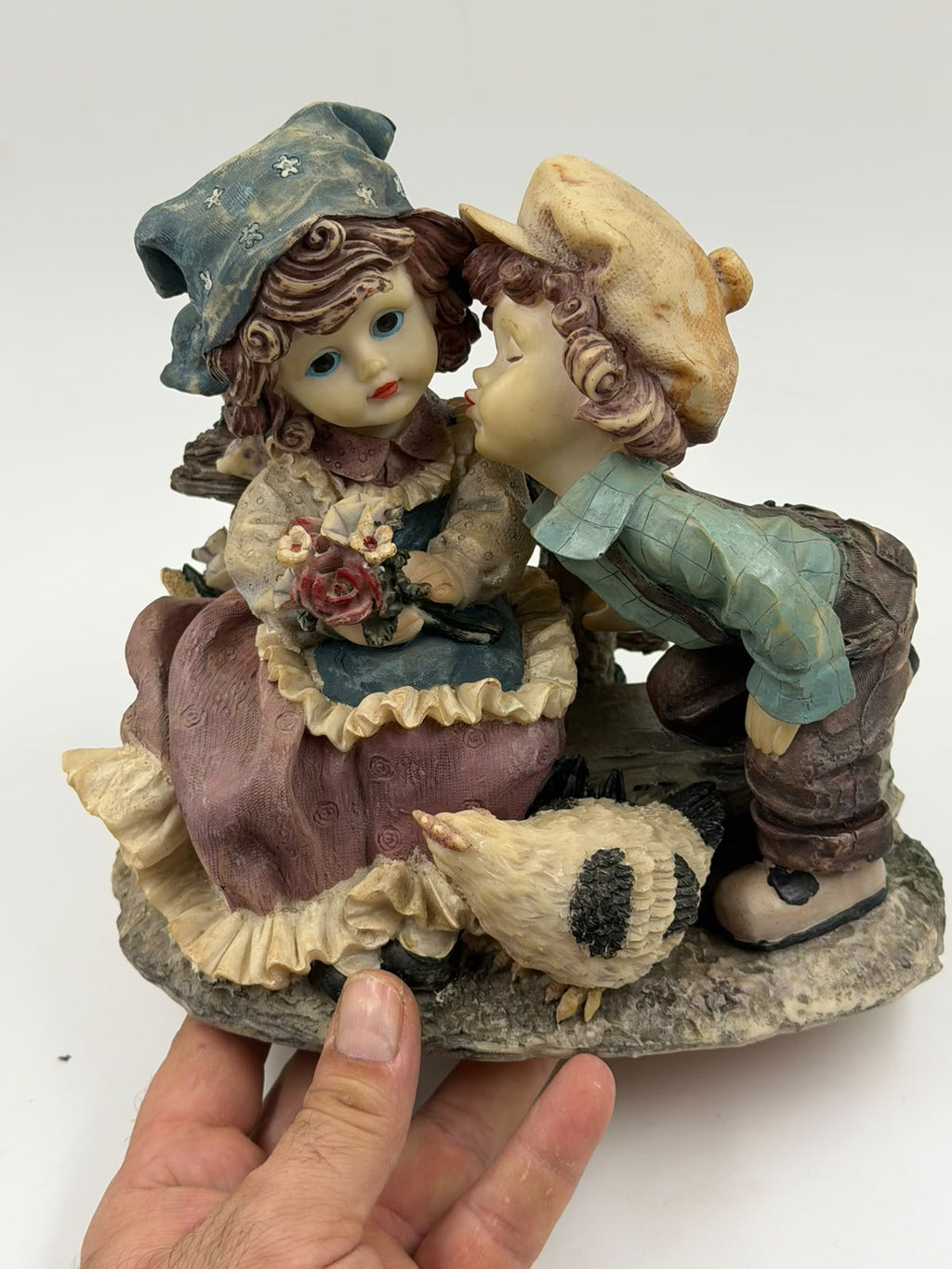 Vintage Victorian resin couple figurine hand size comparison