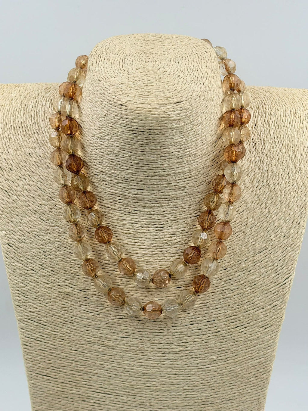 Necklace double wrapped on display bust