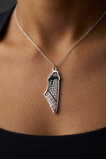 Person wearing sterling silver Palestine map keffiyeh pendant necklace