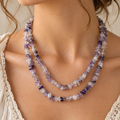Natural amethyst chip necklace worn on young woman neck lifestyle photo